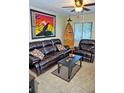 Inviting living room featuring a comfortable dark brown leather sofa and decor at 20857 Haulover Cv # 15, Lutz, FL 33558