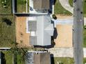 Aerial view of the home showcasing its layout, surrounding yard, and neighborhood at 4024 Dalwood Dr, Holiday, FL 34691