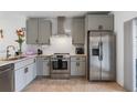 Beautiful kitchen featuring stainless steel appliances, and gray cabinetry at 6027 Bayside Key Dr, Tampa, FL 33615