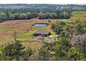 Aerial shot shows house, pond and surrounding land at 6413 Emerson Rd, Brooksville, FL 34601