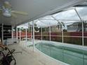 Screened in in-ground swimming pool perfect for relaxation at 7308 Mako Dr, Hudson, FL 34667