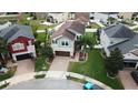 Aerial view of home with a well-manicured lawn and an attractive driveway at 11611 Lake Blvd, New Port Richey, FL 34655