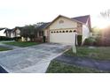 A cozy single-story home with a brick facade and a two-car garage at 4707 Wallingford Ct # 4707, New Port Richey, FL 34655