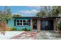 Charming single-story home featuring a brick facade, manicured yard, and inviting entrance at 506 8Th Ave Sw, Largo, FL 33770