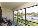 Enjoy the serene lake view from the screened in porch at 7614 Radcliffe Cir # 212B, Port Richey, FL 34668