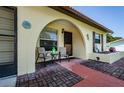 The inviting front porch, arched entryway and brick pavers, perfect for outdoor seating at 8110 Bismark Ct, Port Richey, FL 34668