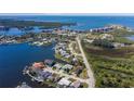 Gorgeous waterfront home with a backyard dock and stunning views of the surrounding canals and waterways at 8401 Carolyn Dr, Port Richey, FL 34668