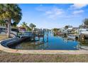 Scenic view of a waterfront canal featuring a boat lift and easy access to open water at 13726 Michelle Ave, Hudson, FL 34667