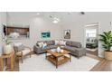 Bright living room with a vaulted ceiling, gray sectional sofa, and stylish decor at 3806 River Oaks Ct, New Port Richey, FL 34655