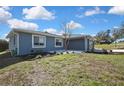 Single-story home with a well manicured front lawn and fresh landscaping at 4206 Candler Ave, Spring Hill, FL 34609