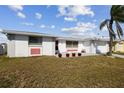 Charming single-Gathering home featuring an attached garage and well-maintained lawn at 6627 Leeside Isle, Hudson, FL 34667