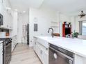 Bright, updated kitchen with white cabinets, a farmhouse sink, and modern appliances at 700 S Harbour Island Blvd # 807, Tampa, FL 33602