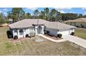 Well-maintained single-story home with manicured landscaping and a spacious front yard at 11257 Frigate Bird Ave, Weeki Wachee, FL 34613