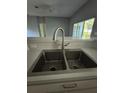 Kitchen features a stainless steel sink with a modern faucet at 11257 Frigate Bird Ave, Weeki Wachee, FL 34613