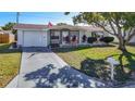 Charming single-story home featuring a well-maintained lawn and attached one car garage at 3632 Pensdale Dr, New Port Richey, FL 34652