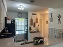 Bright kitchen featuring stainless steel appliances, white cabinets, and an open layout, perfect for modern living at 4925 Myrtle Oak Dr # 22, New Port Richey, FL 34653