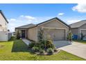 Charming single-story home with well-maintained landscaping and a two-car garage at 5388 Fez Ct, Brooksville, FL 34602