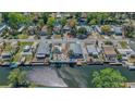 Aerial shot of house on water with docks and palm trees at 6448 W Richard Dr, Weeki Wachee, FL 34607