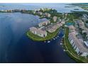 Breathtaking aerial view of waterfront condominium with boat docks and lush landscaping at 8211 Brent St # 816, Port Richey, FL 34668