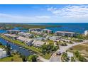 Scenic aerial view of condominium complex with waterfront access and recreational facilities at 8211 Brent St # 816, Port Richey, FL 34668