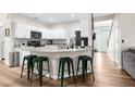 Bright kitchen with white cabinets, center island, and modern fixtures perfect for cooking at 11227 Lakeview Dr, New Port Richey, FL 34654