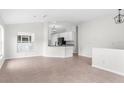 Bright, open-concept living room with tile floors at 12112 Shearwater Dr, New Port Richey, FL 34654