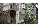 Exterior view of condo complex with stairway leading to second level at 12816 Wedgewood Way # D, Hudson, FL 34667
