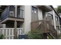 Exterior of condominium showing staircase, balcony and air conditioning unit at 12816 Wedgewood Way # D, Hudson, FL 34667