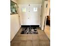 Tile entryway showcasing the double front doors and patterned welcome mat at 2630 63Rd S Ave, St Petersburg, FL 33712