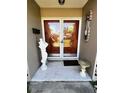 Inviting front entrance with double doors and unique decorative details on the porch at 2630 63Rd S Ave, St Petersburg, FL 33712