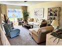 Cozy living room featuring comfortable seating, a large window, and stylish decor at 2630 63Rd S Ave, St Petersburg, FL 33712