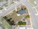 Aerial view of single-story home on large lot surrounded by mature trees at 520 Copperfield Rd, Spring Hill, FL 34606