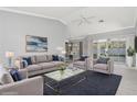 Comfortable living room with plush seating and a neutral color palette, bright and airy at 5912 Willow Creek Ct, New Port Richey, FL 34655