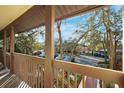 Enjoy the views from this inviting balcony that overlooks the parking and landscaping for a peaceful setting at 7650 Forest Trl # 7, Port Richey, FL 34668