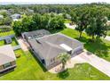 Overhead view of the house showing the private pool, screened enclosure, and spacious yard at 8017 Shepherd Ave, Spring Hill, FL 34606