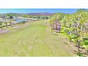 Expansive view of the Timber Greens golf course showcasing lush green fairways and mature trees at 9634 Green Needle Dr, New Port Richey, FL 34655