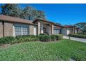 Inviting single-story home showcases beautiful landscaping and a well-kept lawn, adding to its curb appeal at 9713 Sweeping View Dr, New Port Richey, FL 34655