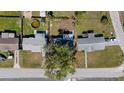 Aerial view of the property, showing the layout of the house and surrounding neighborhood at 10841 Scenic Dr, Port Richey, FL 34668
