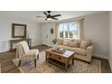 Inviting living room with comfortable seating, natural light, and contemporary decor at 10841 Scenic Dr, Port Richey, FL 34668