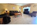 Comfortable living room with neutral tile flooring and well-coordinated furniture at 11817 Bayonet Ln, New Port Richey, FL 34654