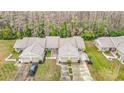 High aerial view showcasing a well-maintained home with lush landscaping, complemented by a two-car garage at 13227 Molitor Ct, Hudson, FL 34669