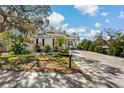 Charming single-story home with well-manicured lawn and inviting curb appeal at 513 Meres Blvd, Tarpon Springs, FL 34689
