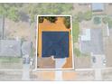 Aerial view of a single-story home on a large lot in a residential neighborhood at 5413 Deltona Blvd, Spring Hill, FL 34606