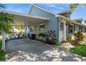 Charming home features a covered carport, landscaped front yard, and inviting entrance at 6710 Devonshire Ln # 10A, New Port Richey, FL 34653