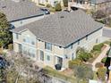 Aerial view of backyard with patio seating area, surrounded by fencing, green grass and landscaping at 7624 Red Mill Cir, New Port Richey, FL 34653