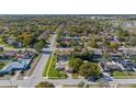 Wide aerial view showcasing a neighborhood with mature trees and well-maintained homes at 7901 Willow Brook Ct, Hudson, FL 34667