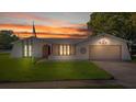 Charming single-story home featuring a well-manicured lawn and attached garage at 7901 Willow Brook Ct, Hudson, FL 34667