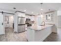 Modern kitchen with granite countertops, stainless steel appliances, and ample storage space at 12215 Snead Pl, Tampa, FL 33624
