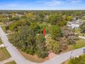 A home surrounded by mature trees and lush landscaping, offering privacy and tranquility at 1267 Meredith Dr, Spring Hill, FL 34608
