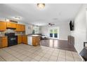 Open kitchen and living room layout, featuring modern appliances and stylish flooring at 1283 Coble Rd, Spring Hill, FL 34608